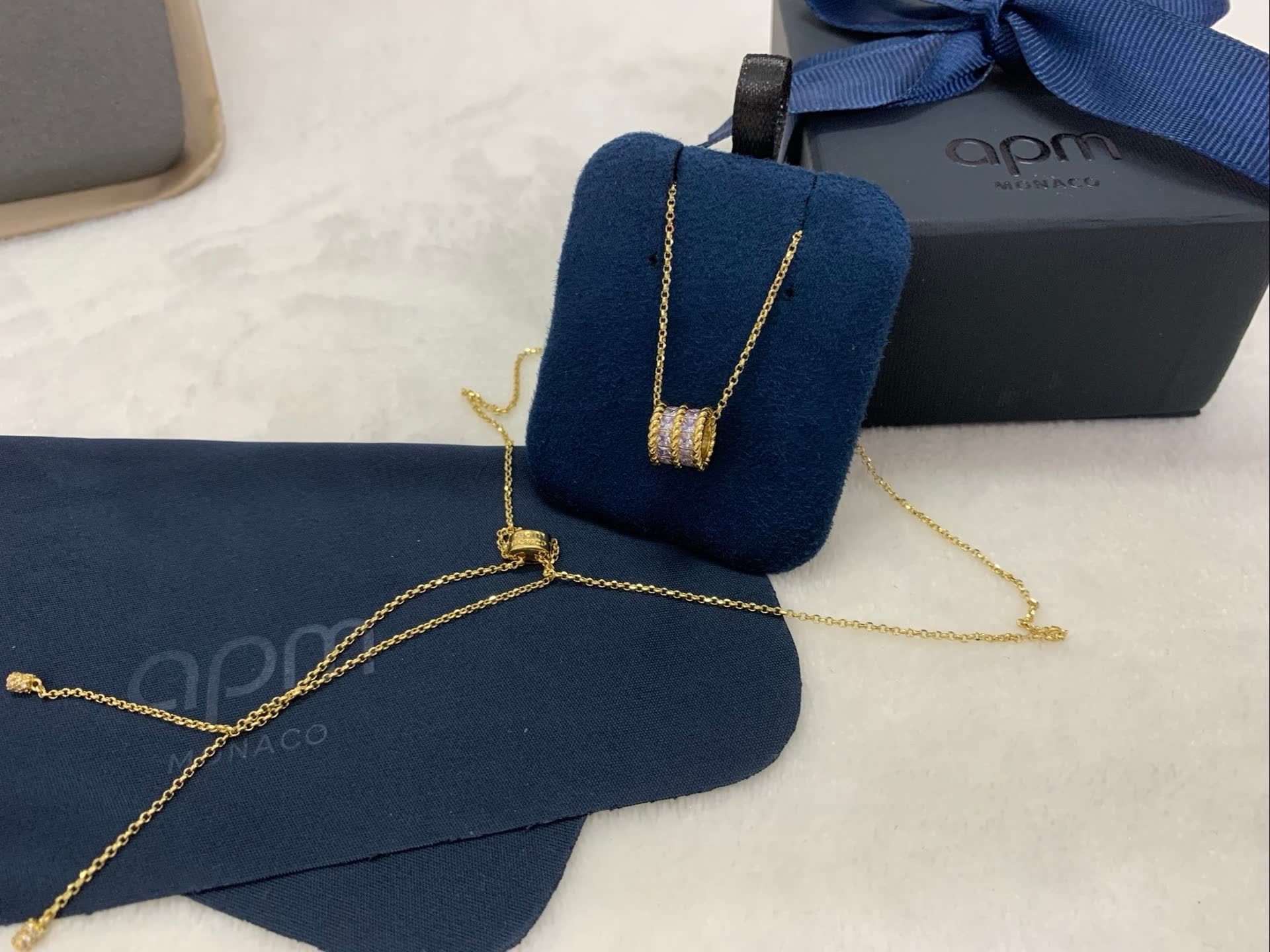 APM Monaco Gold Heart-Shaped Necklace with Purple Stones